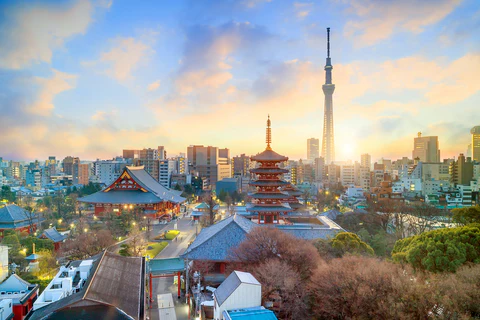 Tokyo Skytree towering over the city skyline at sunset