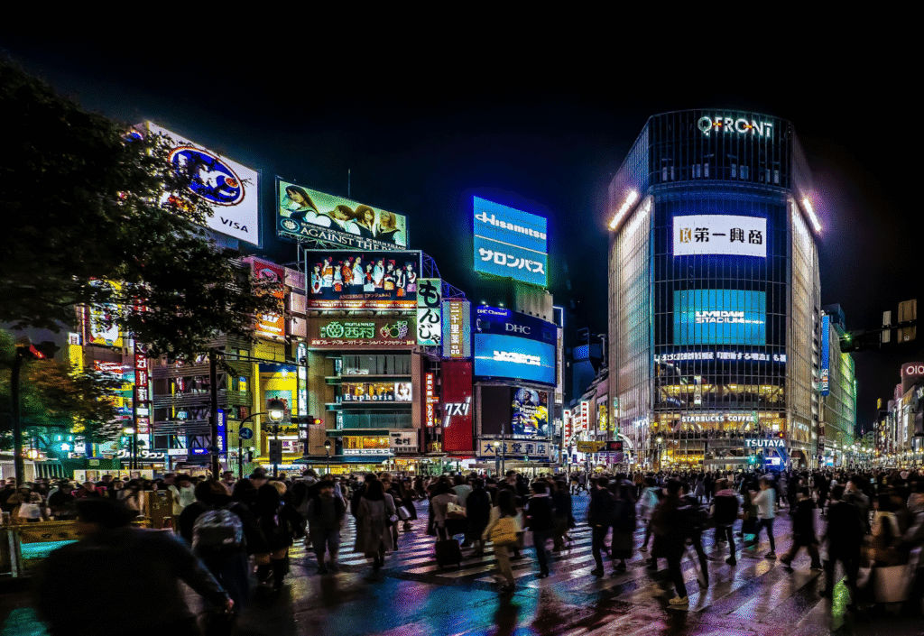 Crowds crossing at the vibrant Shibuya Crossing in Tokyo.
