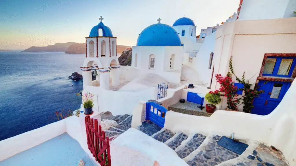 Caldera view with blue-domed churches in Oia, Santorini, Greece

