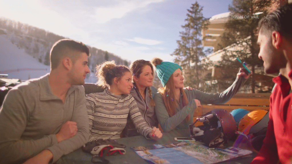 Group of travelers using a map and GPS to navigate through a scenic outdoor location.
